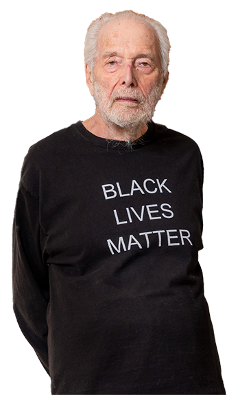 photo of Sandy Berman, an older white man, wearing a Black Lives Matter long sleeved T-shirt